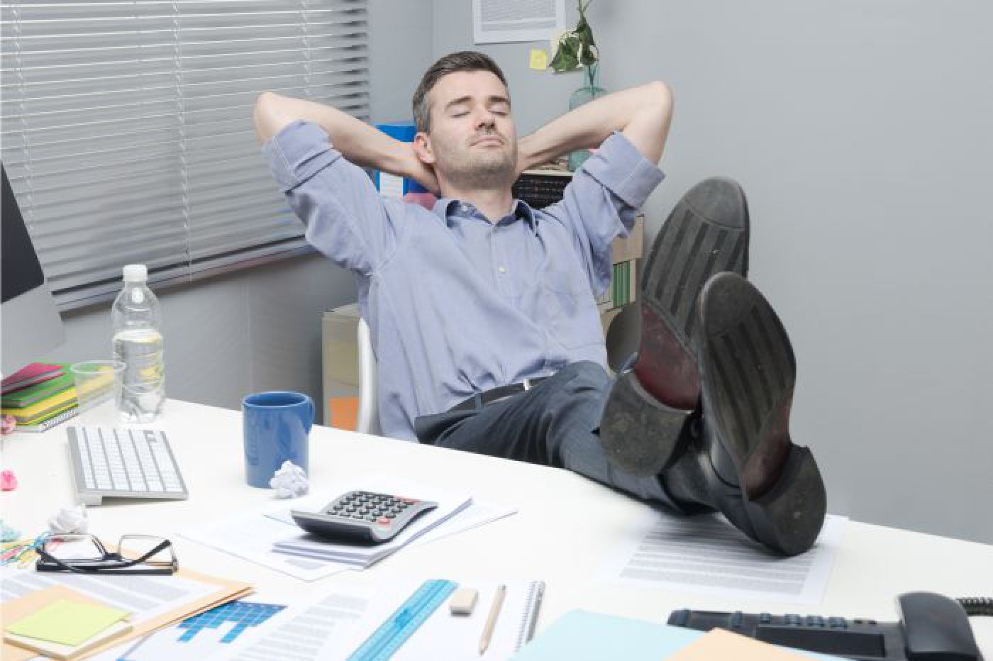 Crate estimator relaxing at his desk