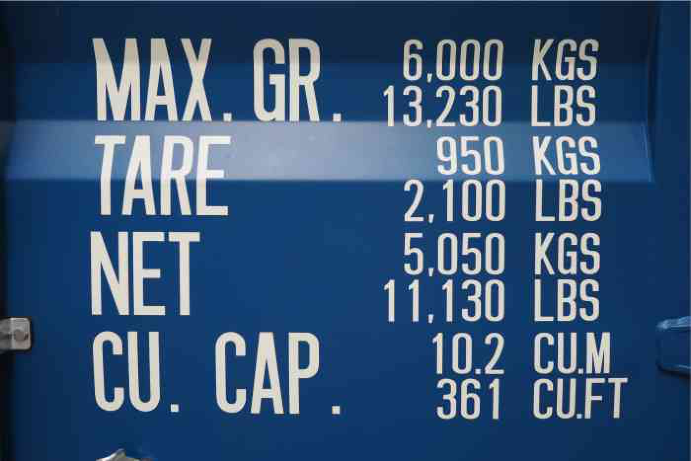 Shipping container door showing imperial and metric